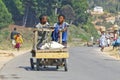 Unknown boys carries a traditional caresa carriage