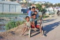 Unknown boys carries a traditional caresa carriage