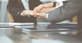 Unknown business people group joining hands in modern office. Businessmen and women making circle with their hands as a Royalty Free Stock Photo