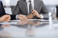 Unknown business people working together at meeting in modern office, close-up. Businessman and woman with colleagues or Royalty Free Stock Photo