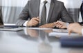 Unknown business people working together at meeting in modern office, close-up. Businessman and woman with colleagues or Royalty Free Stock Photo