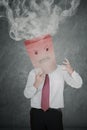 Unknown businessman angry with smoke over his head Royalty Free Stock Photo