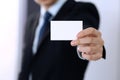 Unknown businessman hand holding business card with empty space, close-up Royalty Free Stock Photo