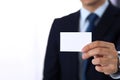 Unknown businessman hand holding business card with empty space, close-up Royalty Free Stock Photo