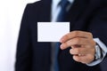 Unknown businessman hand holding business card with empty space, close-up Royalty Free Stock Photo