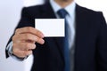 Unknown businessman hand holding business card with empty space, close-up Royalty Free Stock Photo