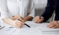 Unknown businessman and woman discussing contract in office. closeup.Business people or lawyers working together at