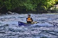 Unknown canoeist, whitewater canoeing at the Minden Wild Water Preserve. Royalty Free Stock Photo