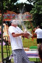 An Unknown Chef Shows Off to the Croud as he Tries to Catch an Egg in a Bowl.