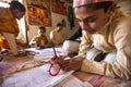 Unknown children doing homework at Jagadguru School.