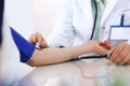 Unknown doctor woman checking blood pressure of female patient, close-up. Cardiology in medicine and health care concept