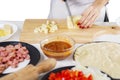 Unknown female chef slicing mozzarella