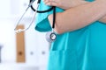 Unknown female doctor holds stethoscope closeup. Physician ready to examine and help patient. Medical help and insurance