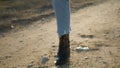 Unknown girl going road countryside closeup. Woman shoes making steps at nature