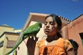 The unknown girls with the parrot on the streets of Potosi.