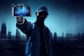 Anonymous hacker holding mobile phone Royalty Free Stock Photo