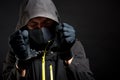 Unknown, indistinguishable thug or hucker in handcuffs and black clothes is arested. Concept: Crime because of crisis Royalty Free Stock Photo