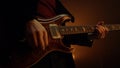 Unknown man hands playing guitar solo in club. Guy musician performing music.