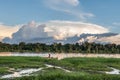 Unknown man on the river bank, near the village. Sunset, end of day. June 26, 2012 in Village, New Guinea, Indonesia Royalty Free Stock Photo