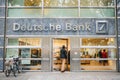 Berlin, October 2, 2017: Unknown man walks into the beautiful glass office of Deutsche Bank Royalty Free Stock Photo