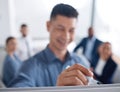 Unknown mixed race business manager training and teaching team of colleagues in office. Hispanic businessman using a Royalty Free Stock Photo