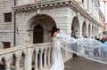 An unknown model poses in front of the Bridge of Sighs in Venice Royalty Free Stock Photo