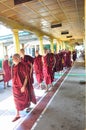 Unknown monks walking at the temple of Shwethalyaung Reclining B