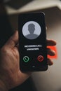 Unknown number calling in the middle of the night. Phone call from stranger. Person holding mobile and smartphone home Royalty Free Stock Photo