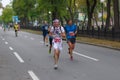 Unknown participant using running hydration pack running on Dnipro city street during 42 km distance of ATB Dnipro Marathon race