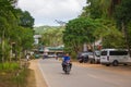 Unknown people on bike on the village street. Asian bikers on motocycle. El Nido landmark. Traditional transport in Asia.