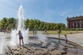 Unknown people seeking refreshment at a hot summer day at the plaza near Berliner Dom