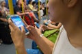Unknown people uses mobile phone while travel by subway