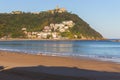 Unknown people walking on the beach called La Concha. Bay of Biscay in San Sebastian in autumn. Wide aerial beach in morning. Royalty Free Stock Photo