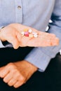 Unknown person holding pills Royalty Free Stock Photo