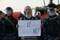 Unknown protester with a poster in the background of police for the shares of Russian opposition for fair elections, may 6, 2012