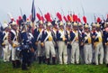 Soldiers holding guns. Borodino reenactment.