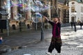 Busker makes soap bubbles in the old city of Dresden