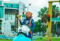 Unknown street performer juggling in front of cars and motorcycles on the street of Cancun in Mexico