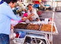 Unknown Street vendor near famous Maeklong Railway Market