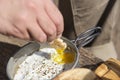 Unknown traveler eating breakfast outdoors, fried eggs and toasted bread slices Royalty Free Stock Photo