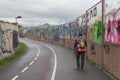 Unknown traveler goes on the road with a backpack