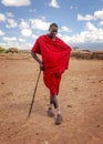 Unknown village near Amboselli park, Kenya - April 02, 2015: Unknown Masai warrior posing for tourists in traditional bright red