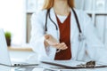 Unknown woman-doctor offering helping hand, close-up. Friendly and cheerful gesture Royalty Free Stock Photo