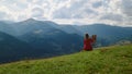 Unknown woman painting masterpiece on green hill. Girl drawing on easel outdoors Royalty Free Stock Photo