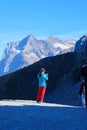 Unknown woman photographing her friend before mountains in Jungfraujoch, Switzerland on 14 October, 2023, during in the afternoon