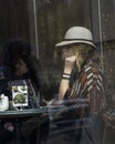 An unknown woman sits in a Chicago cafe