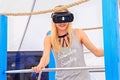 ZELENOGRADSK, KALININGRAD REGION, RUSSIA - JULY 29, 2017: Unknown young woman in virtual reality glasses in the gaming pavilion..