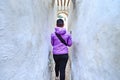 Unknown young woman walking in the old narrow street of Tetouan Medina quarter