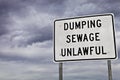 Unlawful Sewage Dumping Sign Royalty Free Stock Photo