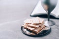 Unleavened bread, chalice of wine, Holy Bible on grey background. Christian communion for reminder of Jesus sacrifice. Easter